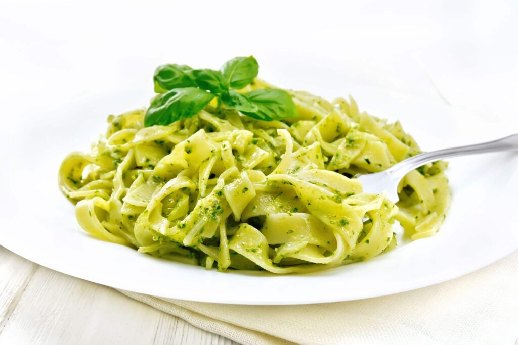 Magical Butter Machine — Best Recipes of 2021 - pasta with pesto sauce in plate on white board 36PMX38 1